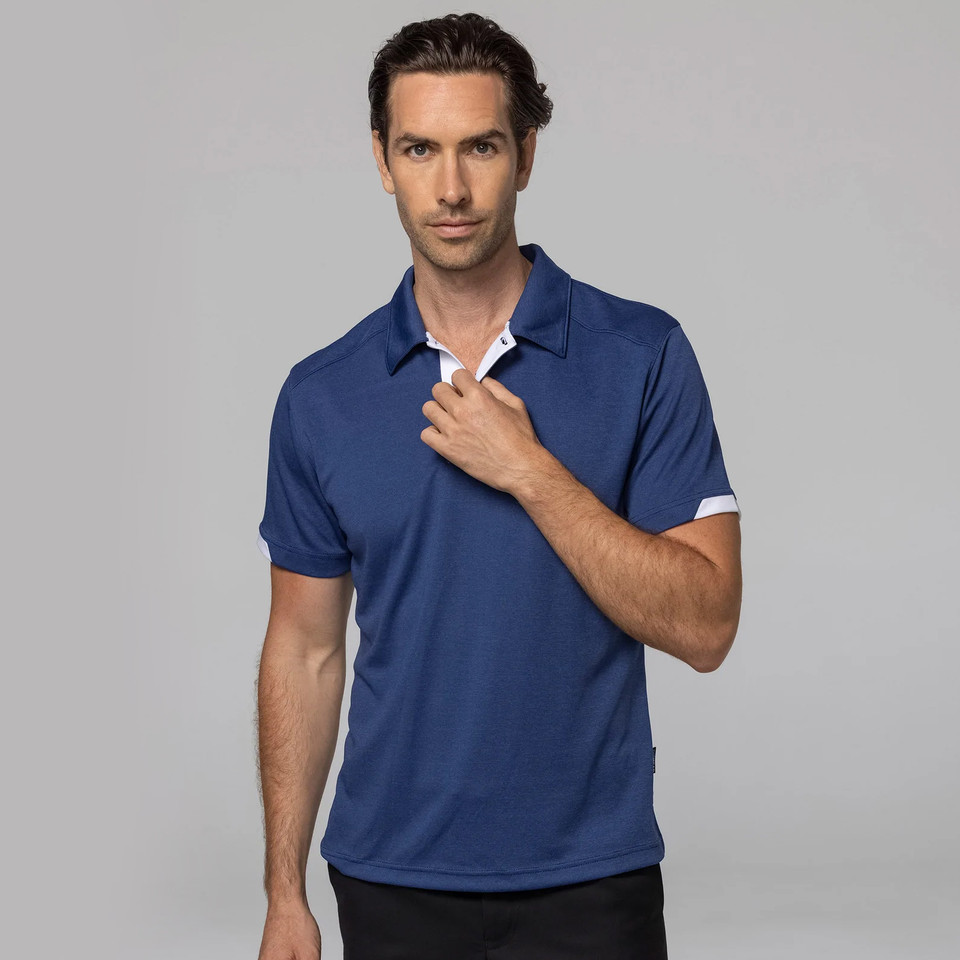 Royal blue polo shirt with white contrast collar and sleeve trims featuring moisture-wicking fabric