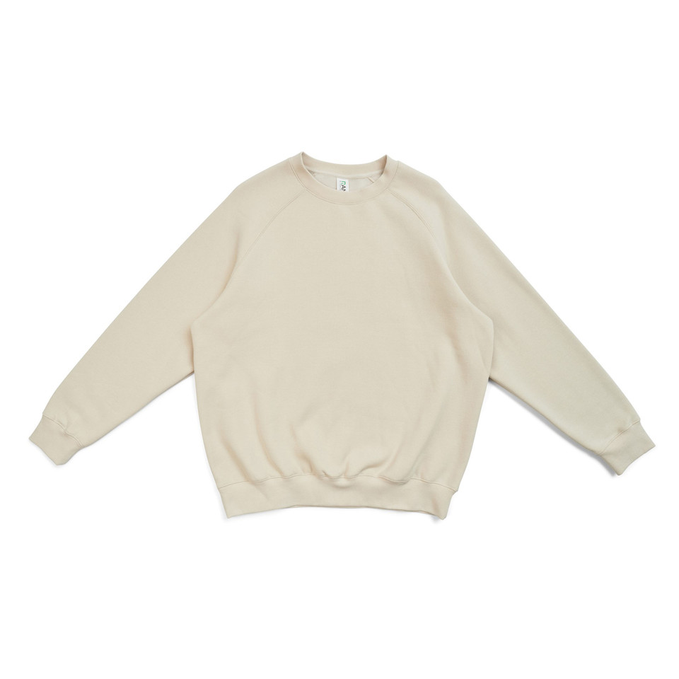 Natural beige cotton-rich crew neck sweater with raglan sleeves and ribbed cuffs on white background