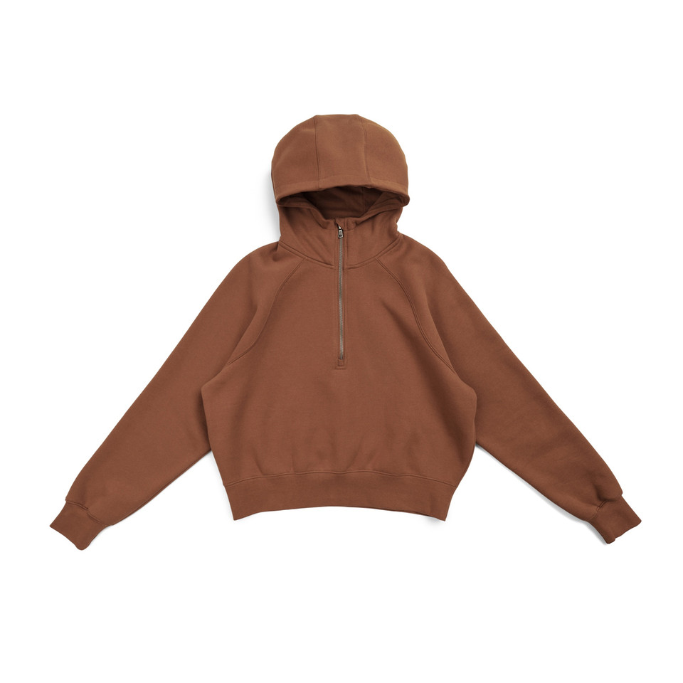 Rust brown half-zip hoodie with hood and ribbed cuffs laid flat on white background