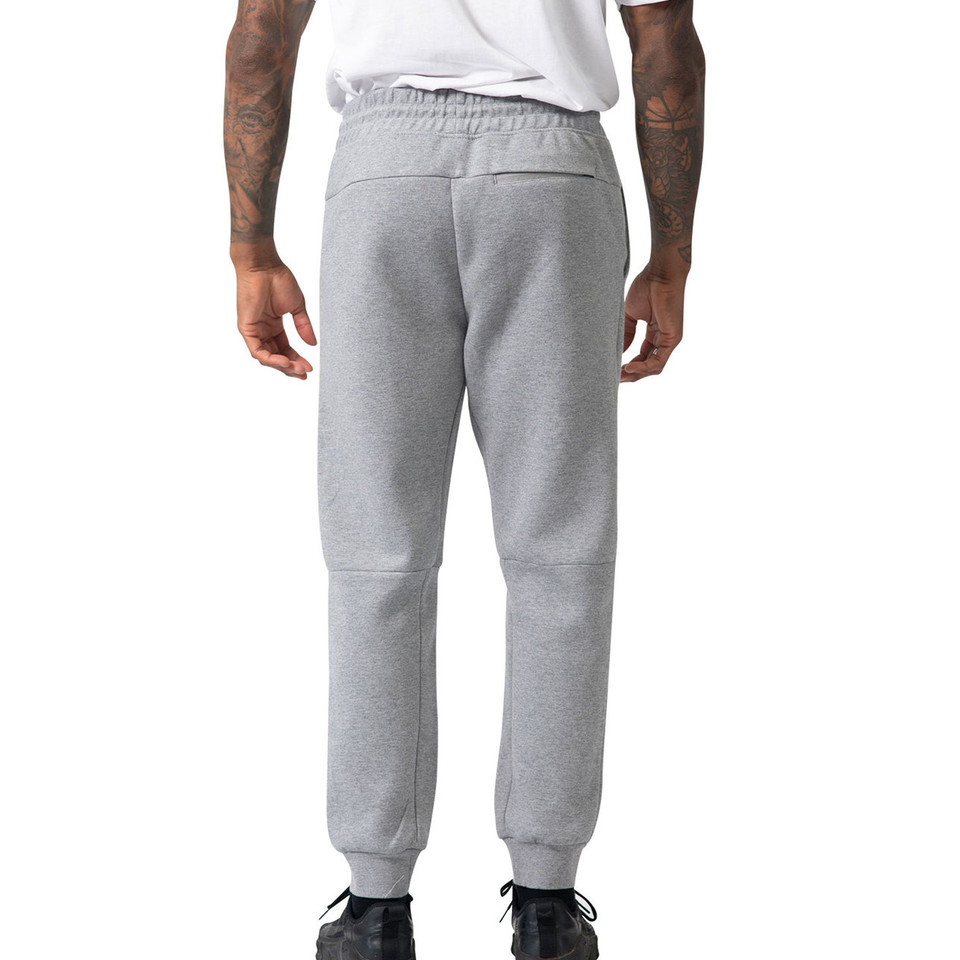 Rear view of heather grey men's jogger track pants with ribbed cuffs, elastic waistband and knee panel detail
