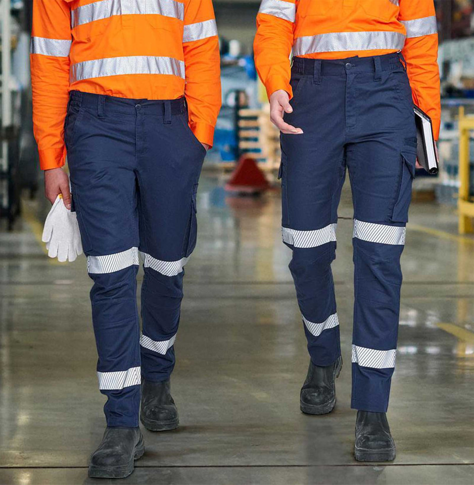 Navy cotton ripstop work pants with silver reflective segmented tape and cargo pockets paired with orange hi-vis shirts