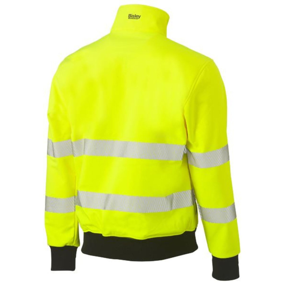 Back view of fluorescent yellow hi vis softshell bomber jacket with two reflective tape bands and dark navy ribbed hem and cuffs