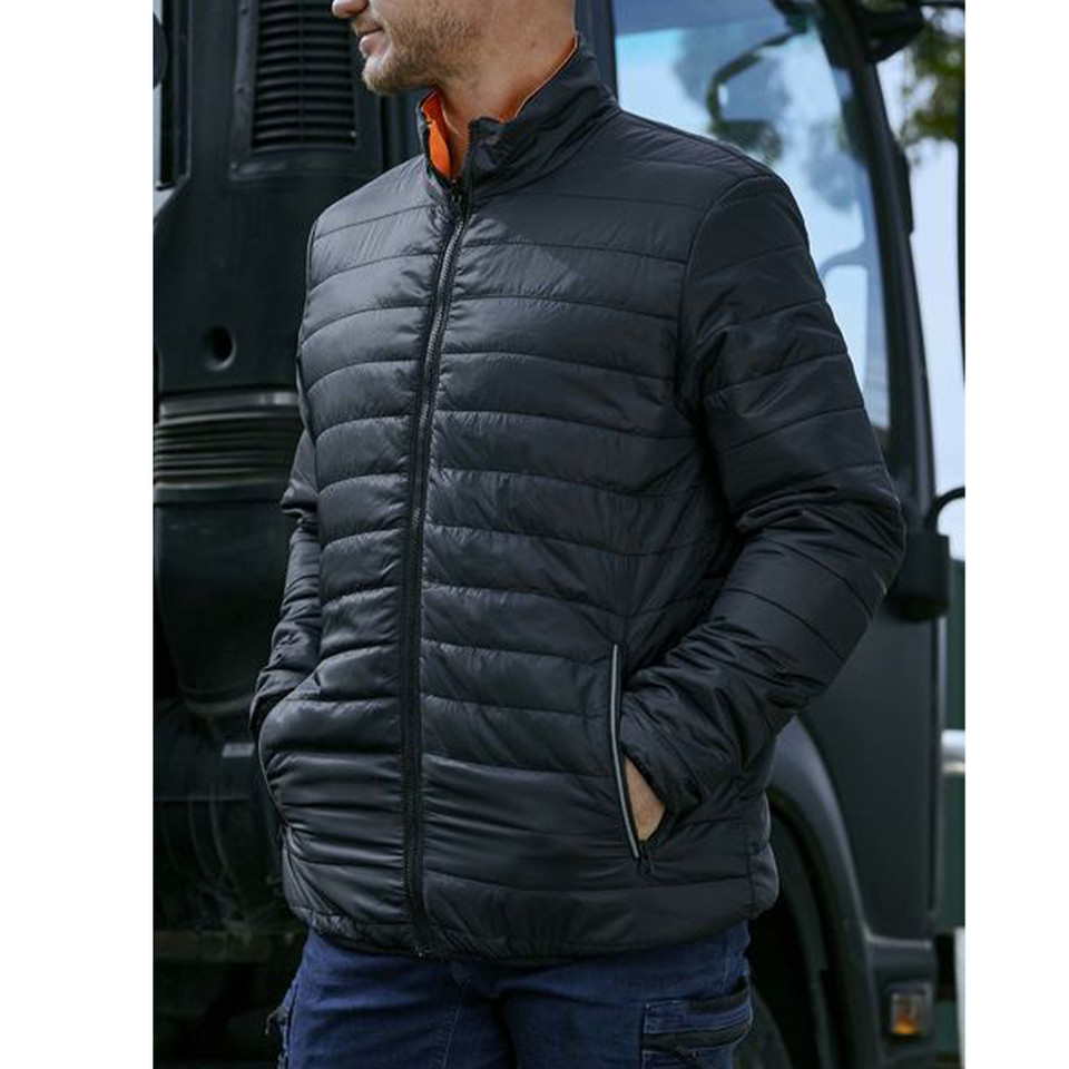 Man wearing black quilted puffer jacket with orange inner lining visible at collar, zip front, side pockets