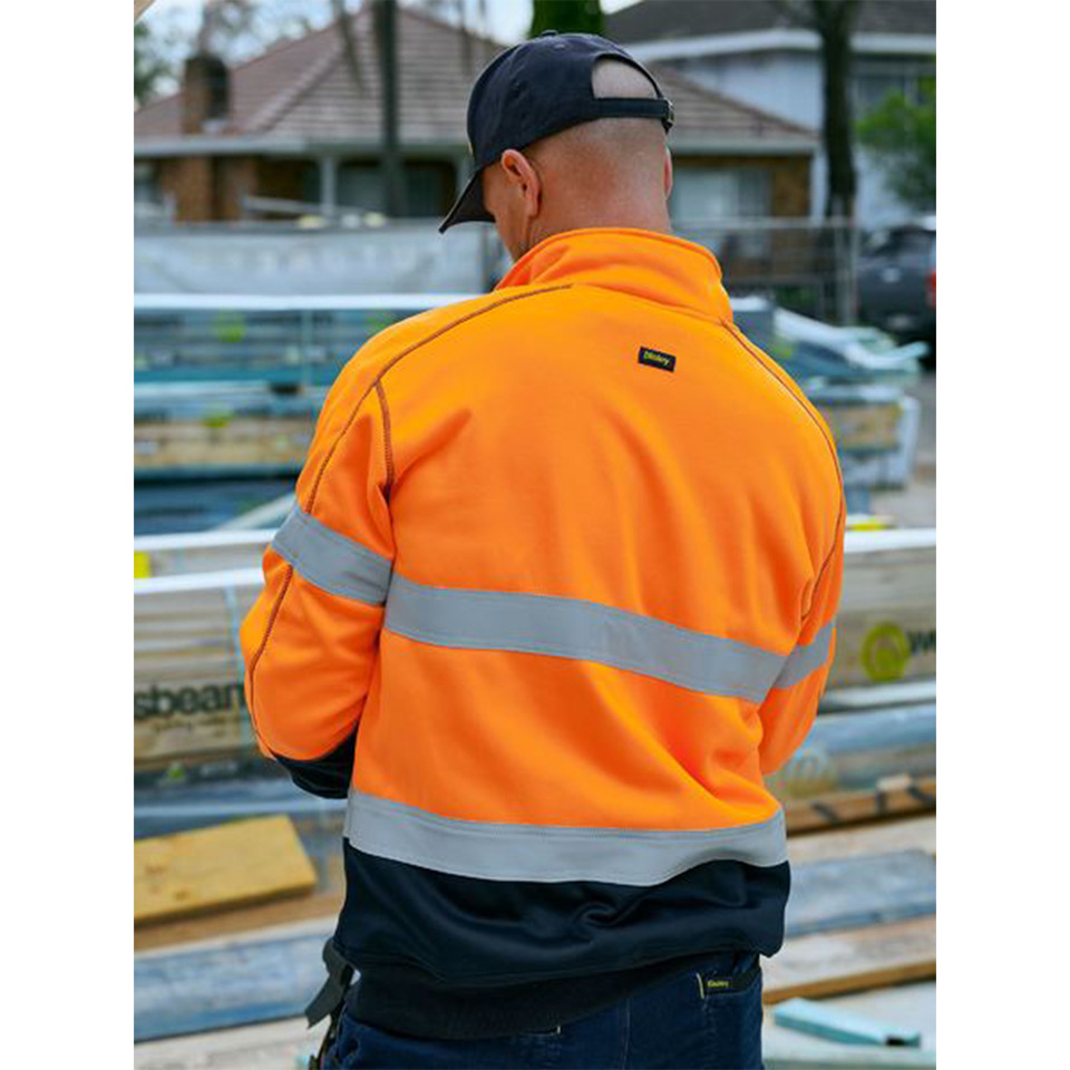 Fluorescent orange and navy hi-vis fleece pullover with silver reflective tape across back and sleeves, rear view