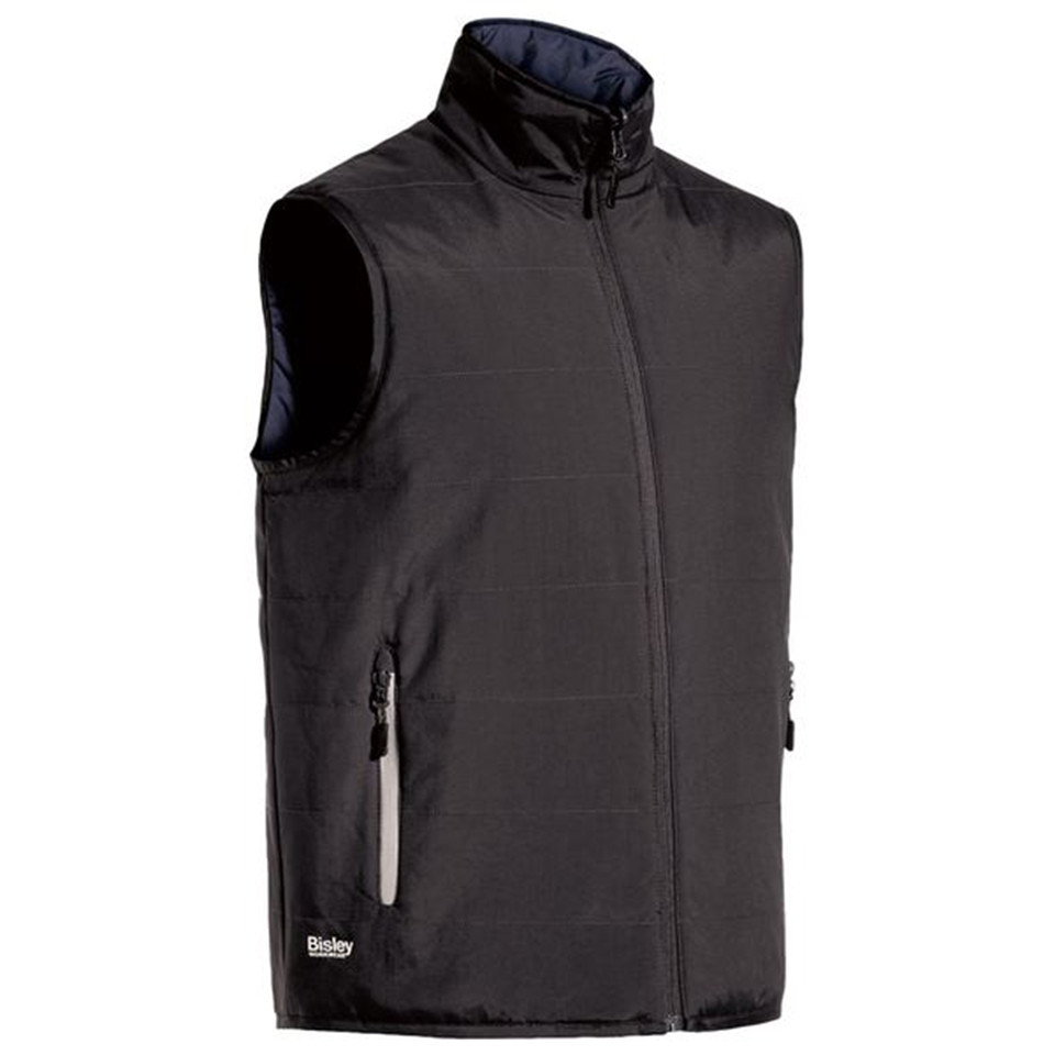 Charcoal quilted puffer vest with zip chest pocket, stand collar, and navy reverse lining visible at armhole