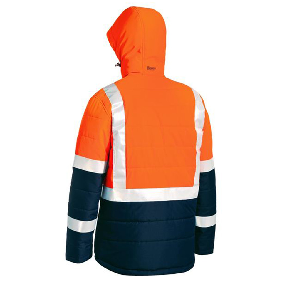 Rear view of orange and navy hi vis puffer jacket with hood and reflective tape bands