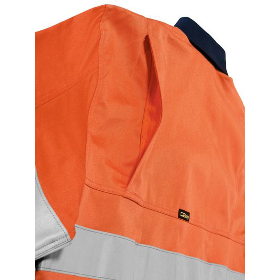 Orange and navy hi vis work shirt close-up showing reflective tape, side vents, and woven label