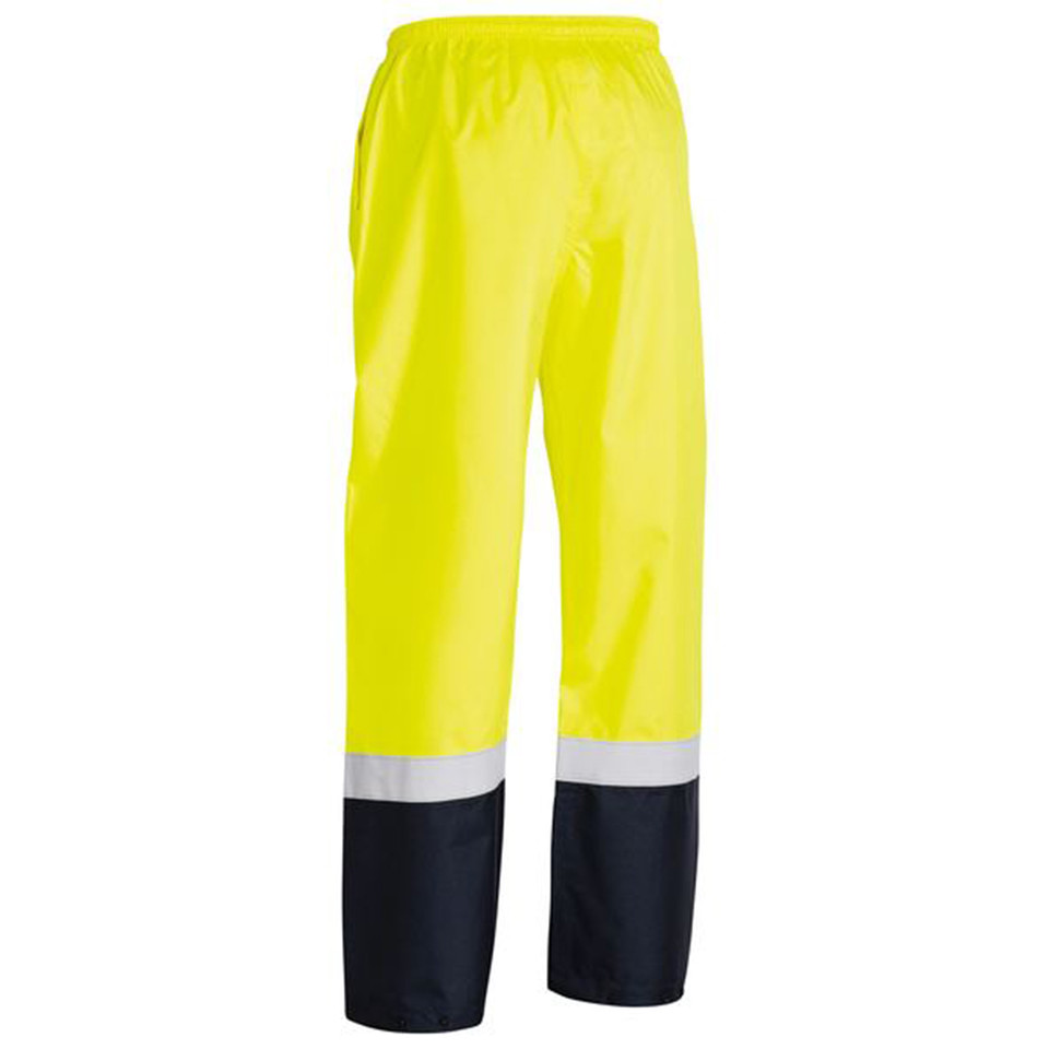 Safety yellow hi-vis rain pants with reflective tape and navy lower legs