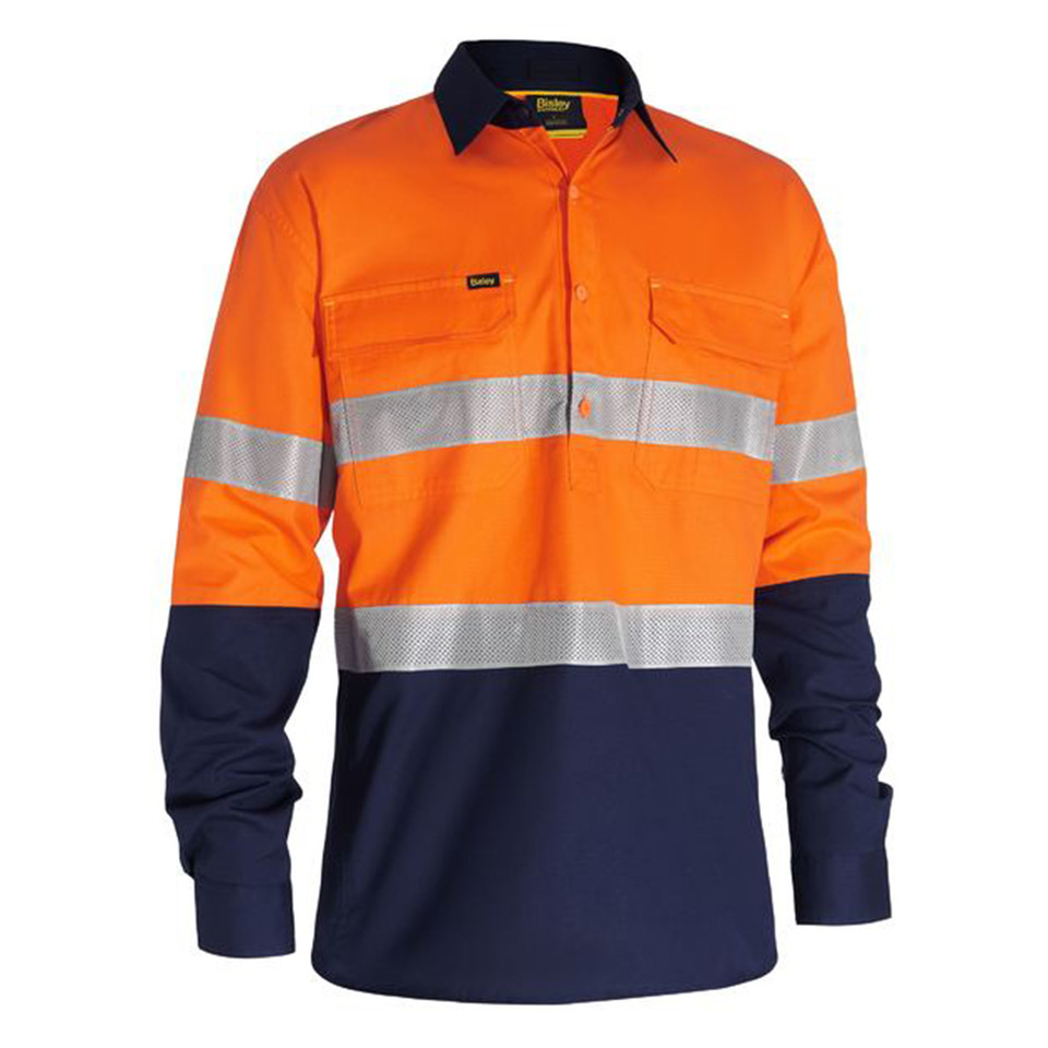 Hi-vis shirt with orange upper body, navy lower sleeves and bottom, silver reflective tape, chest pockets, and navy collar