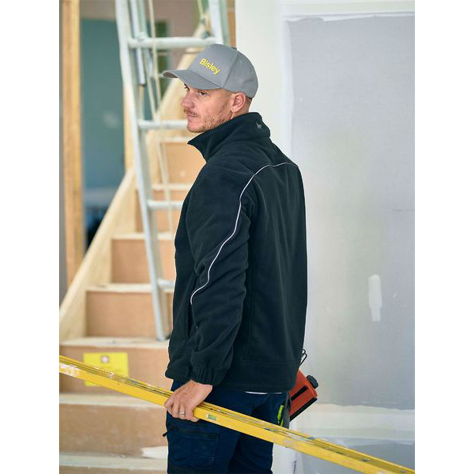 Black bonded micro fleece windproof jacket with contrast white piping detail and full zip closure