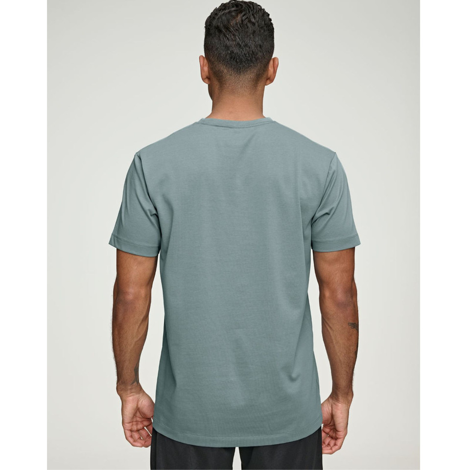 Rear view of man wearing a slate teal crew neck tee with clean back panel and short sleeves