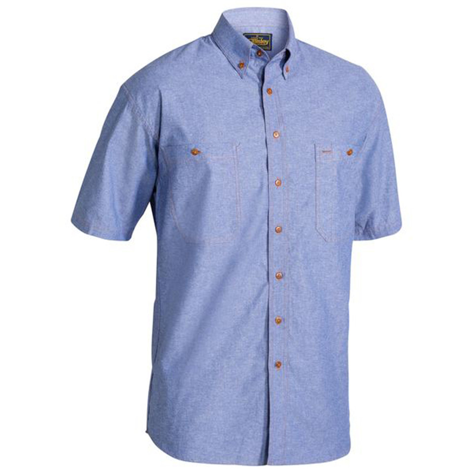 Chambray blue men's short sleeve shirt with button-down collar, twin chest pockets and contrast tan buttons