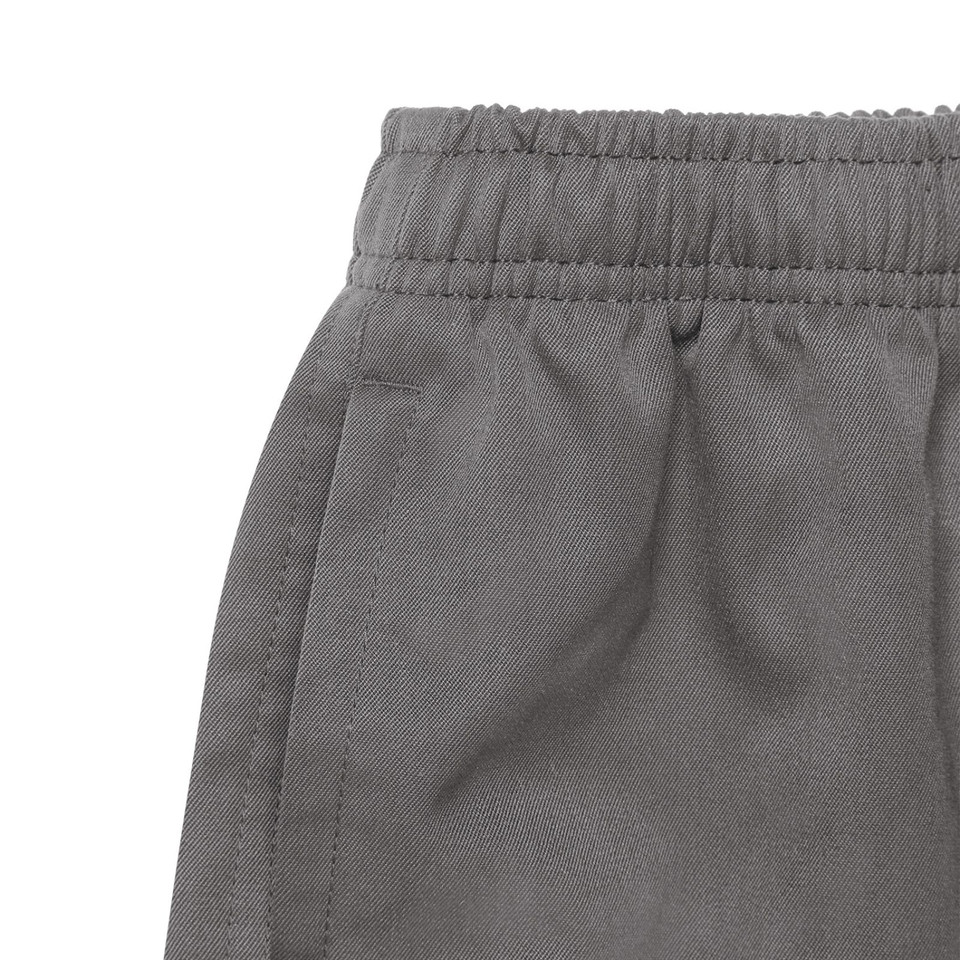 Charcoal grey kids pull-on short with elasticised waistband and side pocket, twill fabric close-up