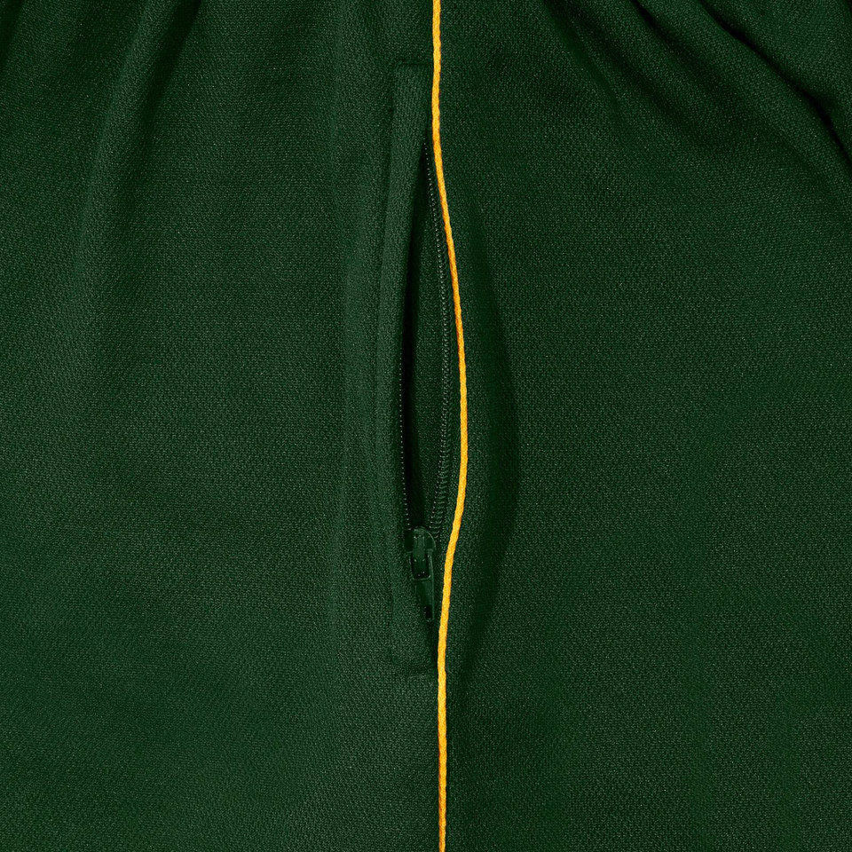 Close-up of bottle green sport skort with gold contrast piping and zippered side pocket