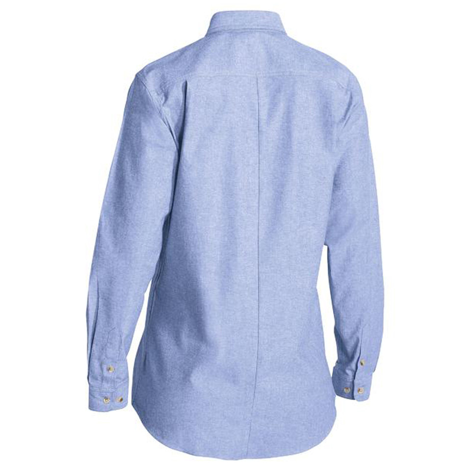 Back view of a women's long sleeve chambray shirt in pale blue with gold buttons and centre back pleat