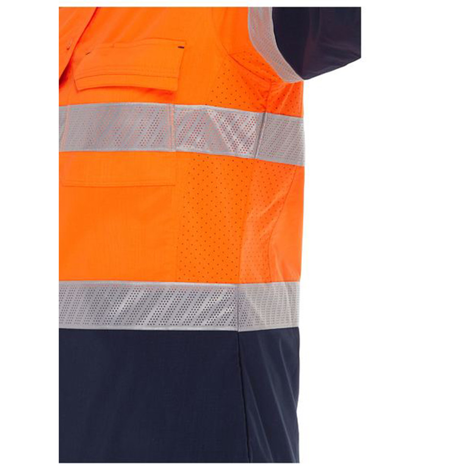 Close-up of orange and navy hi vis shirt showing reflective tape, perforated mesh panels and chest pocket on model