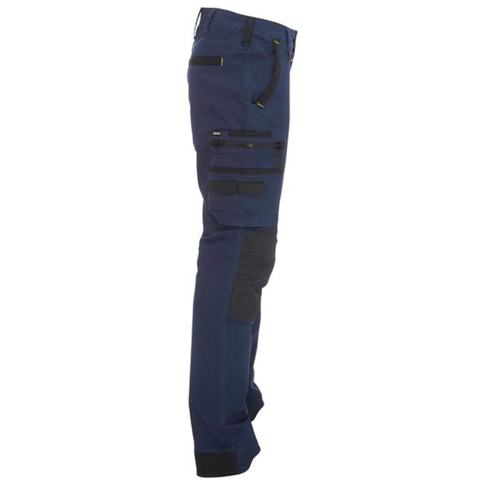 Navy stretch cargo pants with black contrast panels, zip pockets, and knee reinforcement — side view
