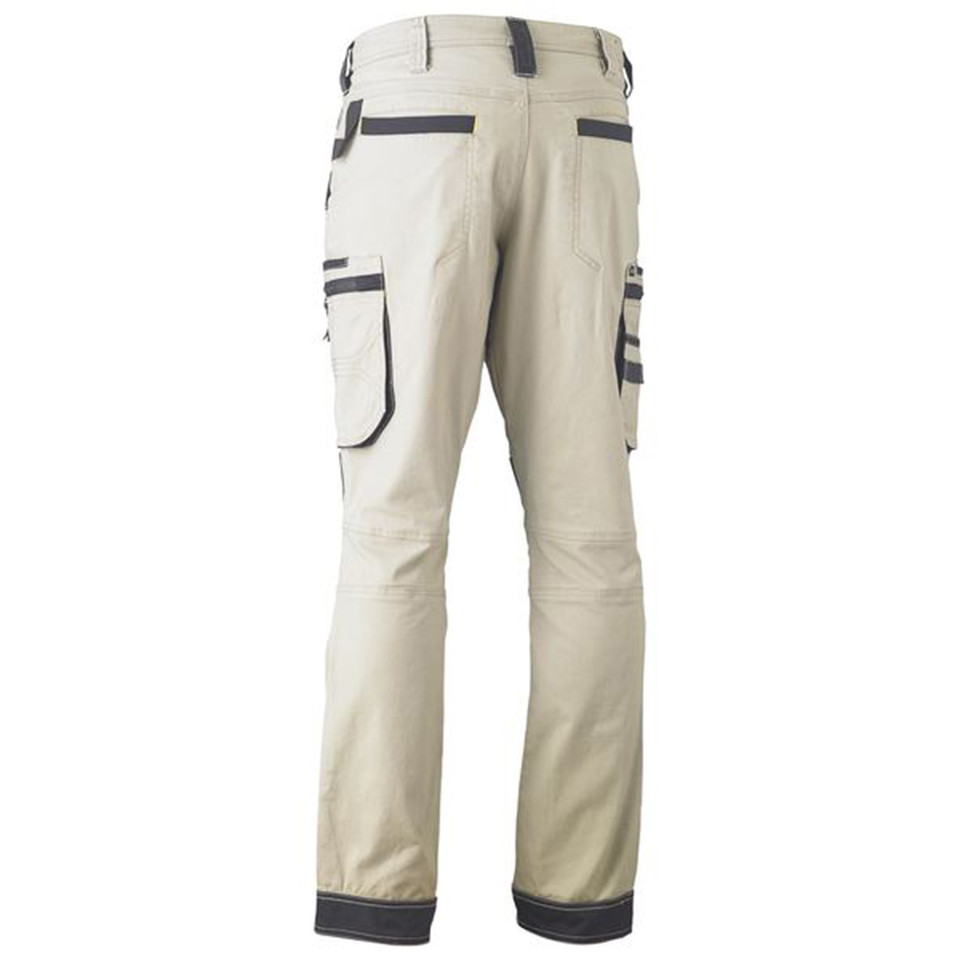 Sand cargo work pants rear view with charcoal contrast panelling, multi-pocket utility design and reinforced hem cuffs