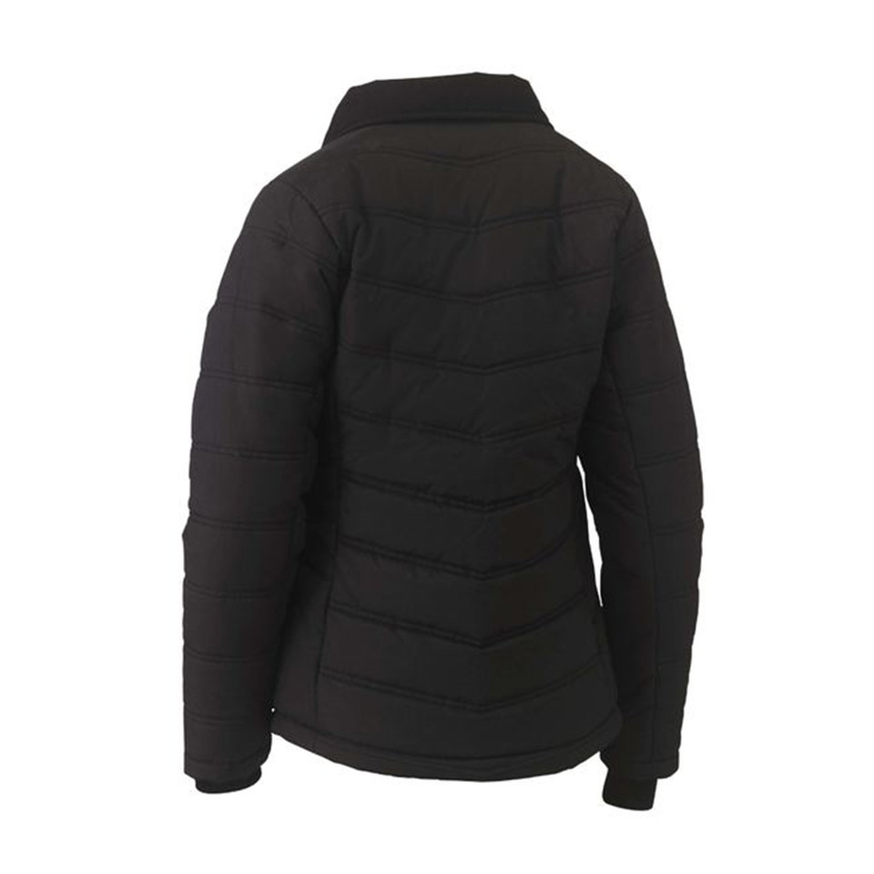 Back view of black women's puffer jacket with chevron quilting, stand collar and fitted silhouette