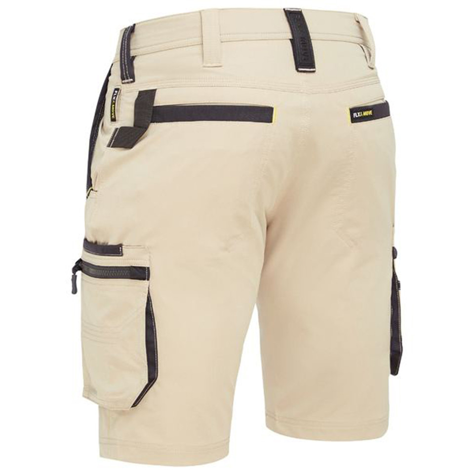 Stone beige cargo shorts with charcoal contrast trim, multiple zip pockets, and stretch fabric construction