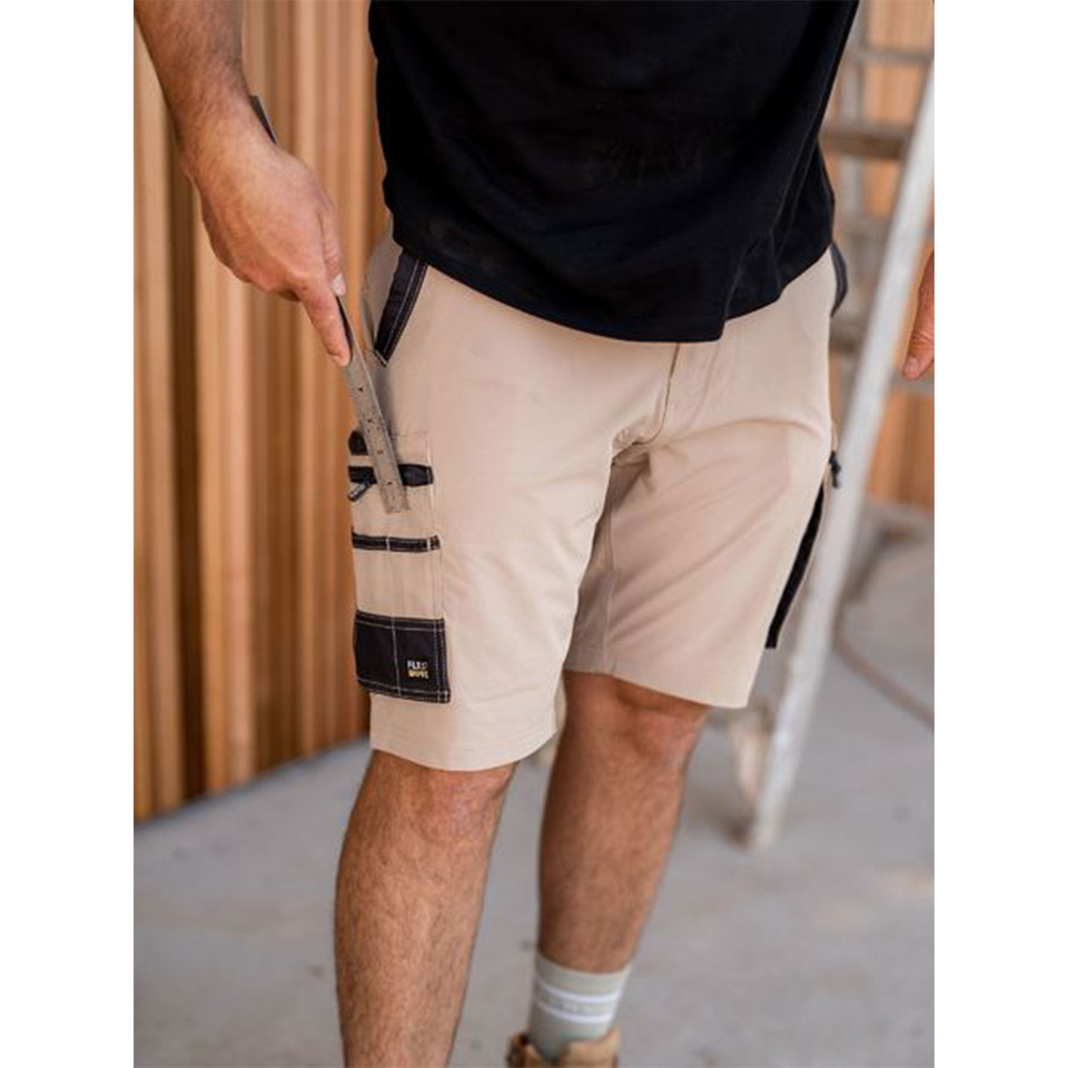 Stone beige cargo shorts with black contrast zip pocket detail and leg cargo pockets on model