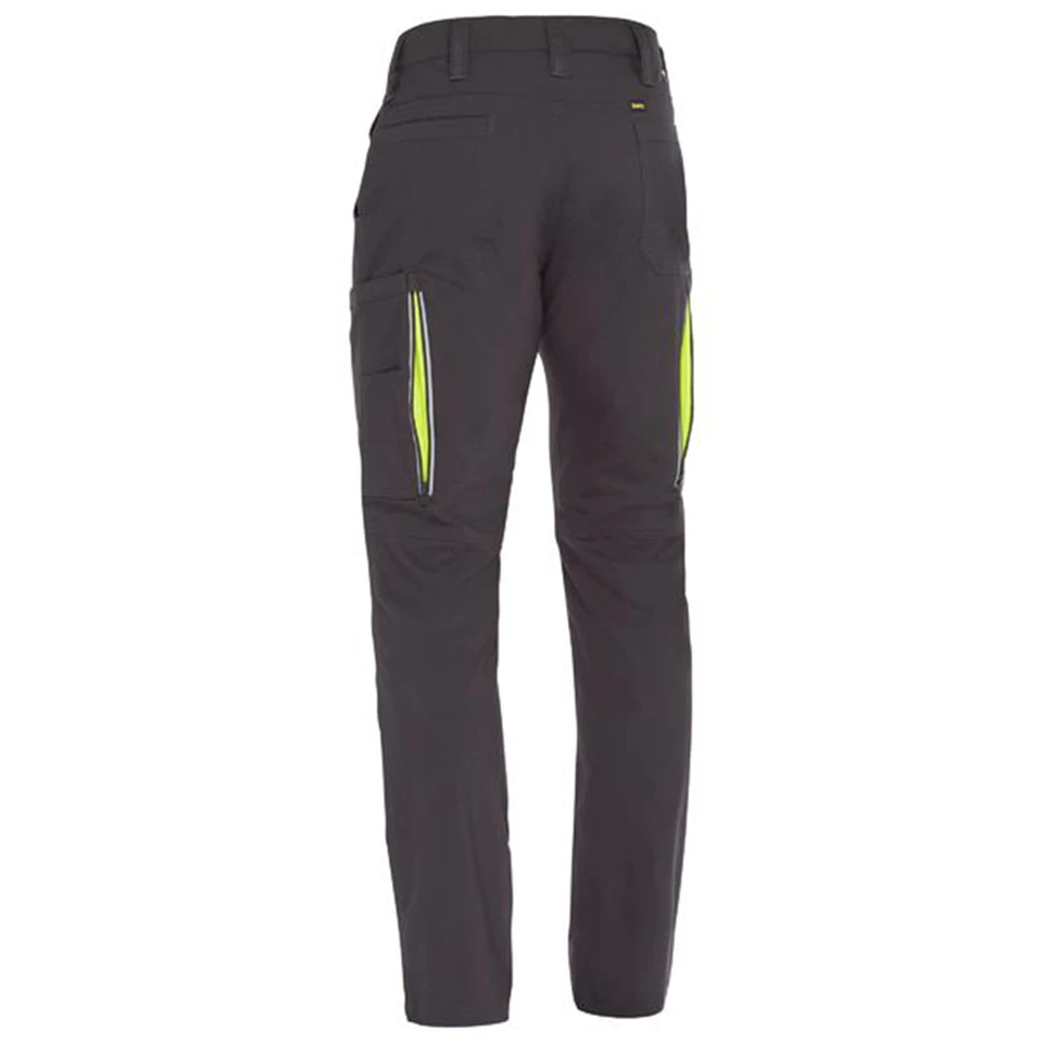 Charcoal ripstop cargo pants with neon yellow zipper vents on thigh pockets, rear view