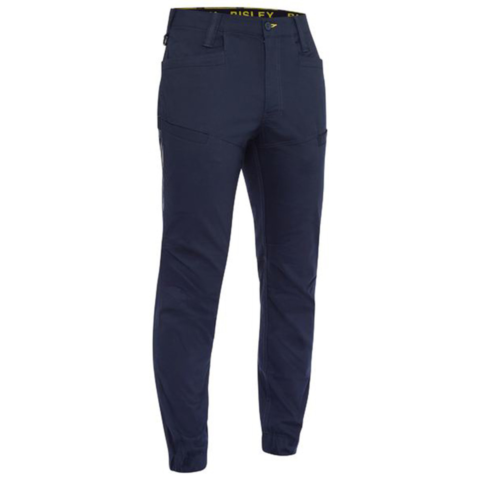 Navy ripstop work pants with stretch fabric, cuffed ankles, and yellow branded waistband detail