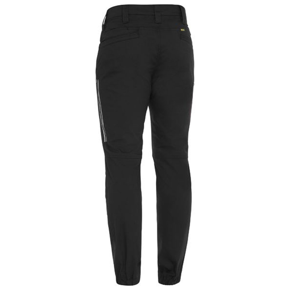 Black stretch ripstop work pants with white side piping and elastic cuffs, rear view showing back pockets