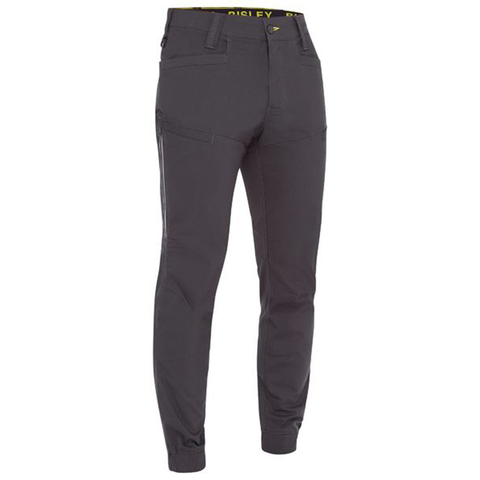 Charcoal grey ripstop work pants with elasticated cuffs and yellow waistband detail