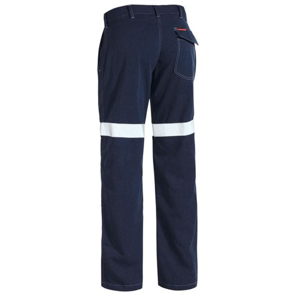 Navy fire resistant work pants rear view with single white reflective tape band across lower leg