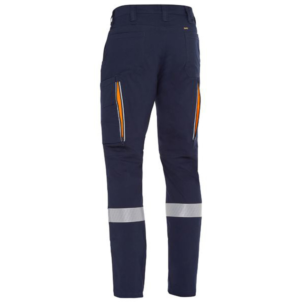 Navy stretch cargo work pant rear view with orange panelling, side cargo pocket and reflective ankle tape