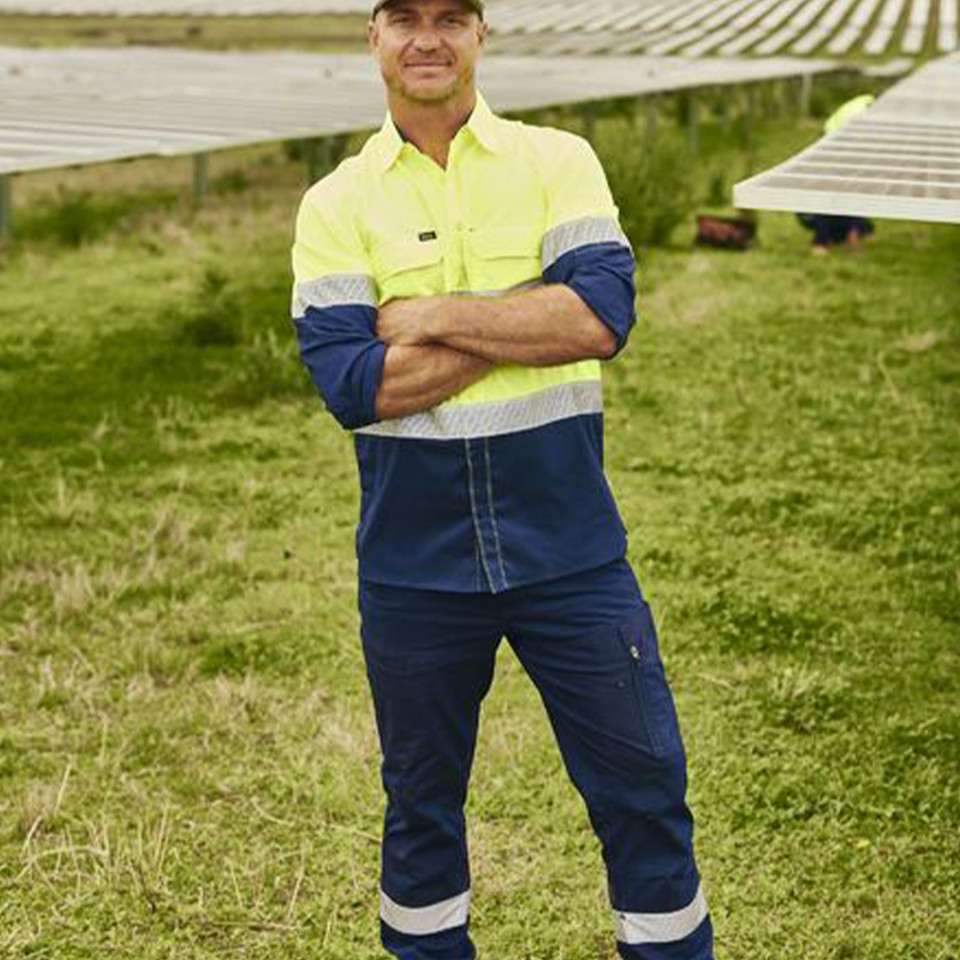 Male worker in hi-vis site setting wearing navy stretch ripstop cargo pants with reflective leg tape
