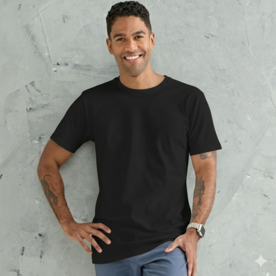 A male model wearing a black LOFT Mens Premium Cotton Tshirt with a longer body, a mid-weight, regular fit, and a crew neck.