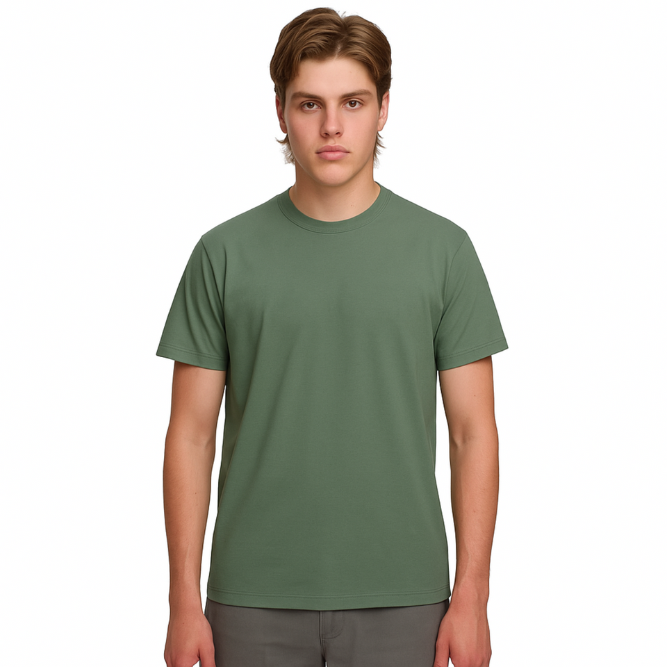 A male model with light brown hair wearing a plain mineral green Soho Men's Premium New Tech Cotton Face T-shirt, standing against a white background. A male model with light brown hair wearing a plain mineral green Soho Men's Premium New Tech Cotton Face T-shirt, standing against a white background.