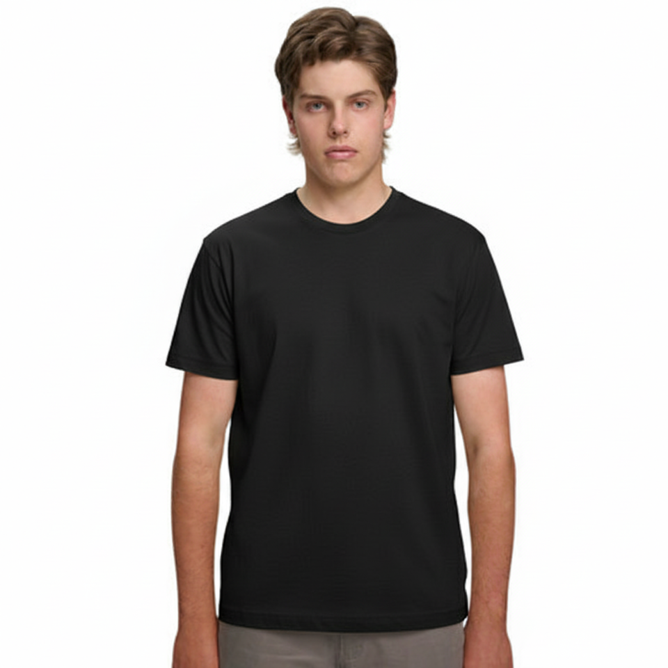 A male model with light brown hair wearing a plain black Soho Men's Premium New Tech Cotton Face T-shirt, standing against a white background.