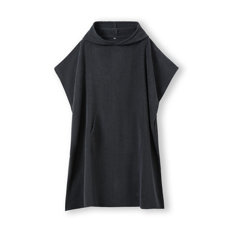 Charcoal grey hooded towel poncho with kangaroo pocket and short sleeves laid flat on white background