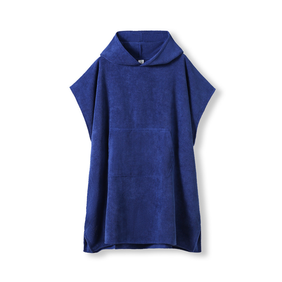 Royal blue hooded towel poncho with kangaroo pocket and short sleeves in soft terry fabric