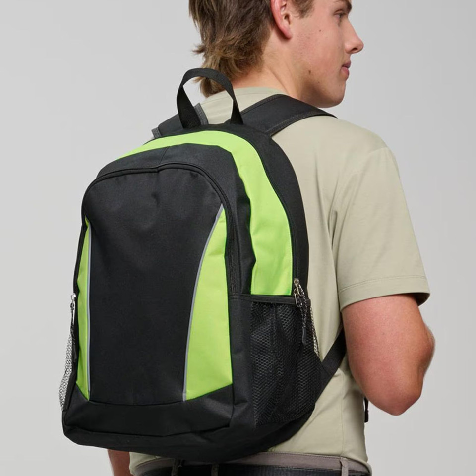 Male model wearing black and lime green structured backpack with reflective piping and side mesh pocket