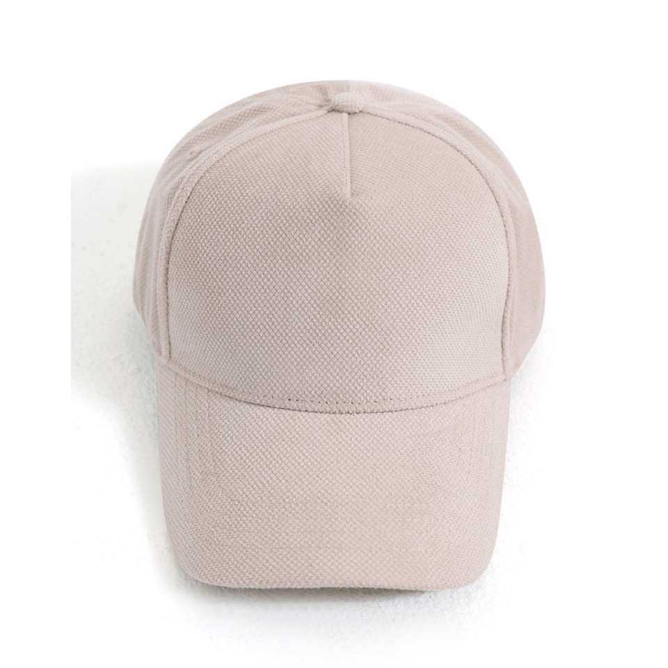 Soft petal pink textured baseball cap with curved brim and structured 5-panel construction