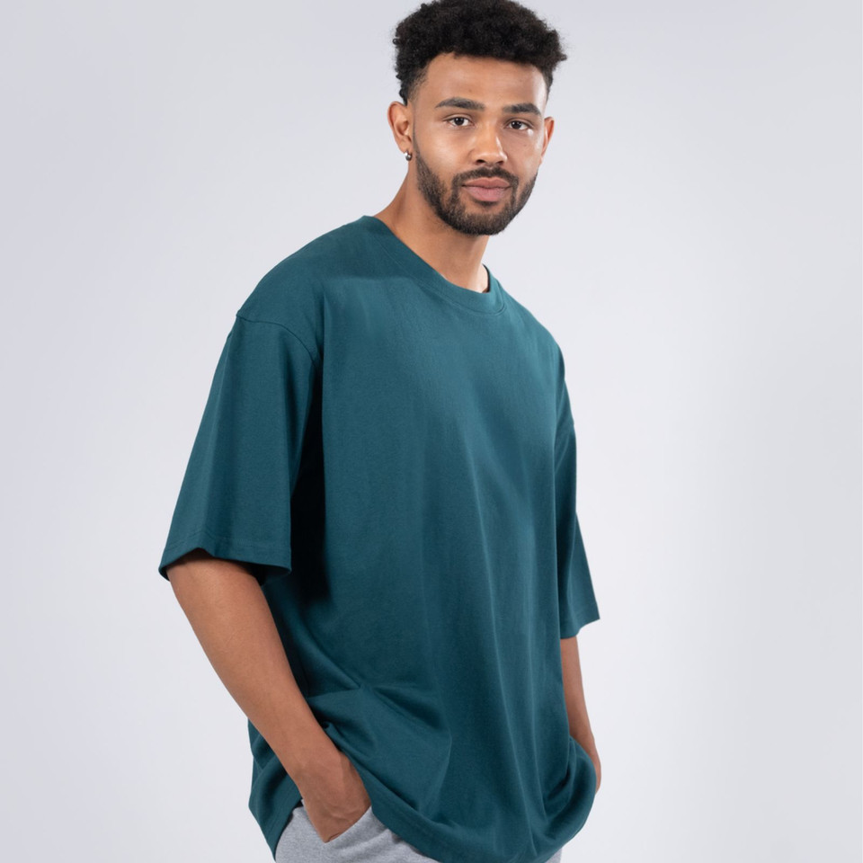Faith Unisex Oversize Easy Fit T-Shirt, a comfortable, relaxed-fit tee made from sustainable organic cotton, ideal for streetwear.