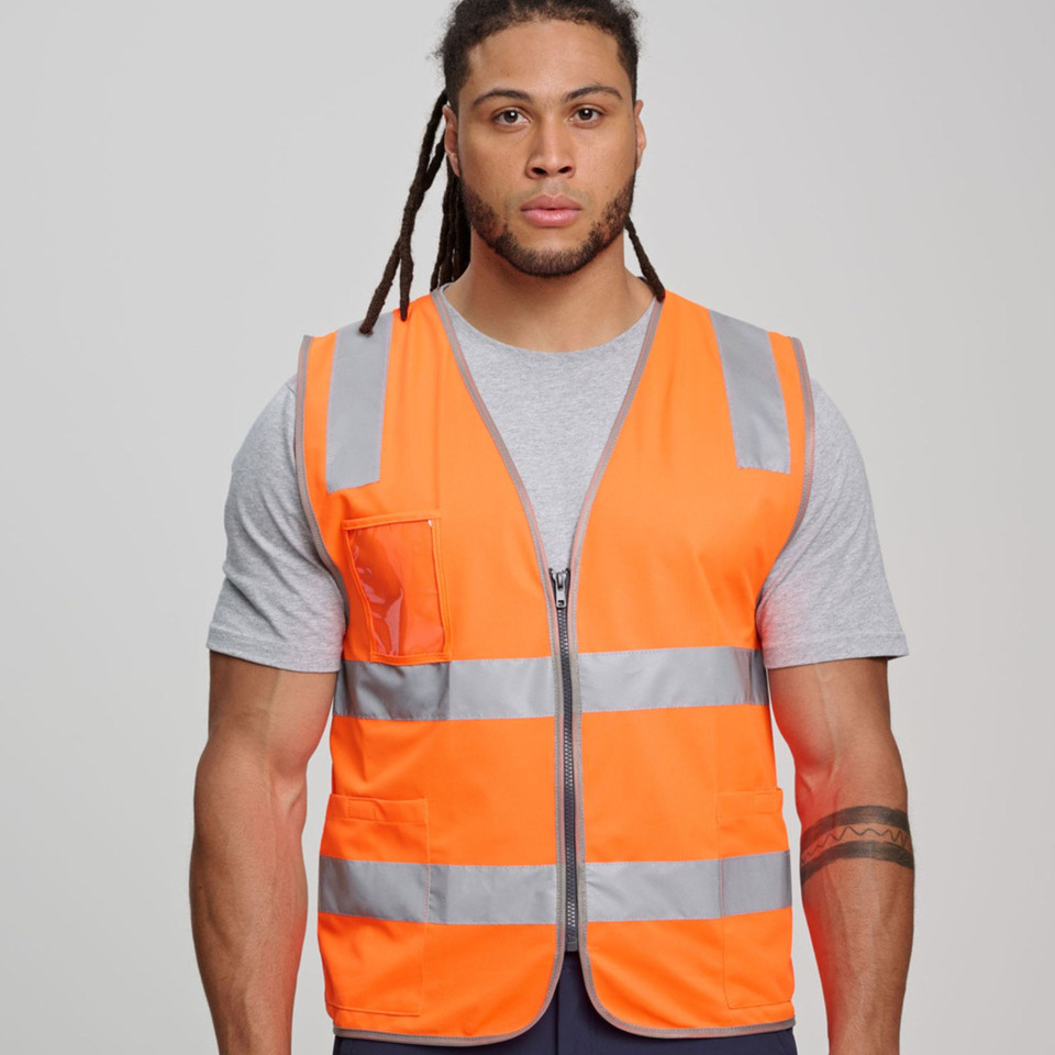 Male model wearing fluoro orange hi-vis safety vest with silver reflective tape, front zip, chest pocket and ID holder