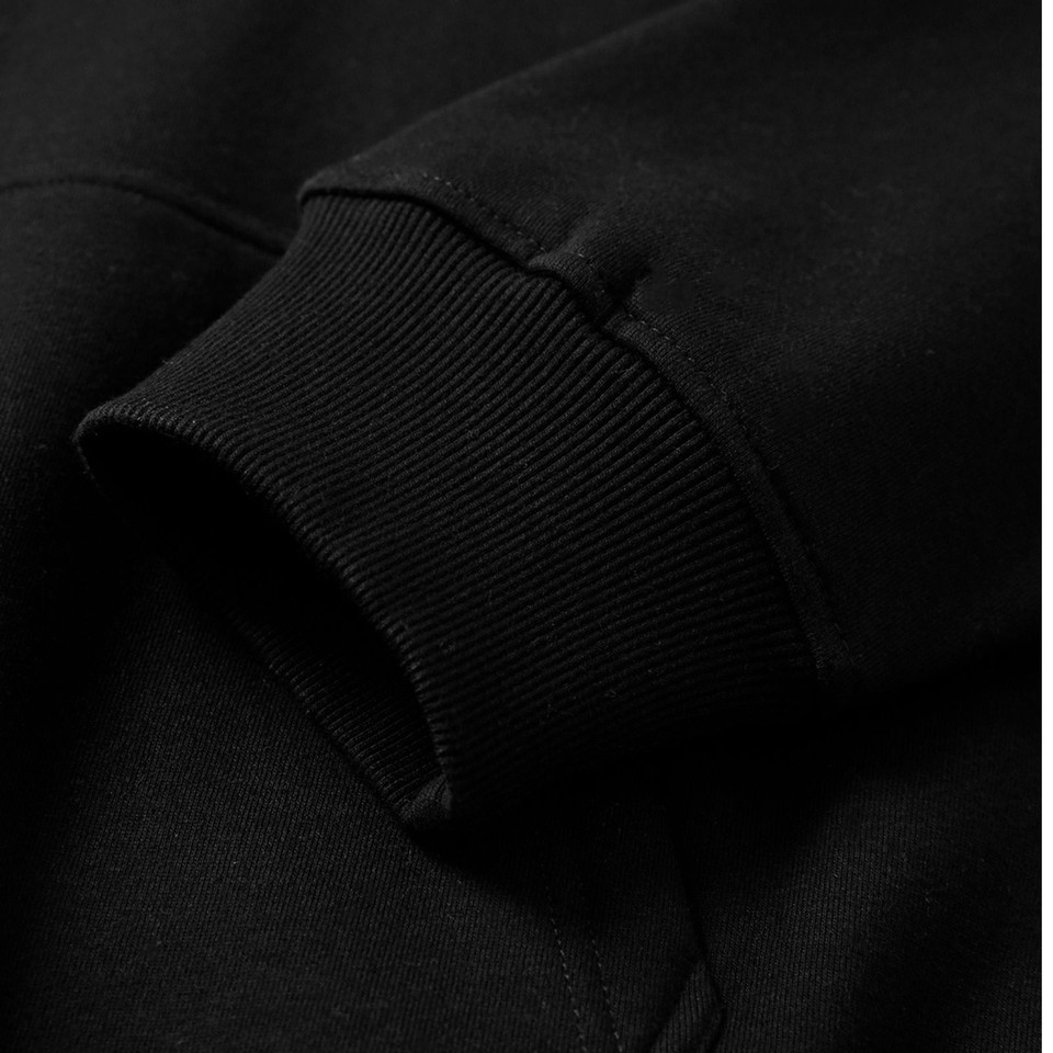 Black oversized hoodie featuring ribbed cuff detail and cotton-rich fabric construction