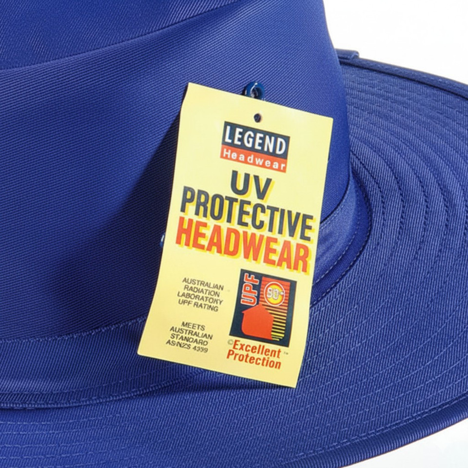 Royal blue wide-brim sun hat with UPF 50+ Legend Headwear hangtag, smooth structured crown