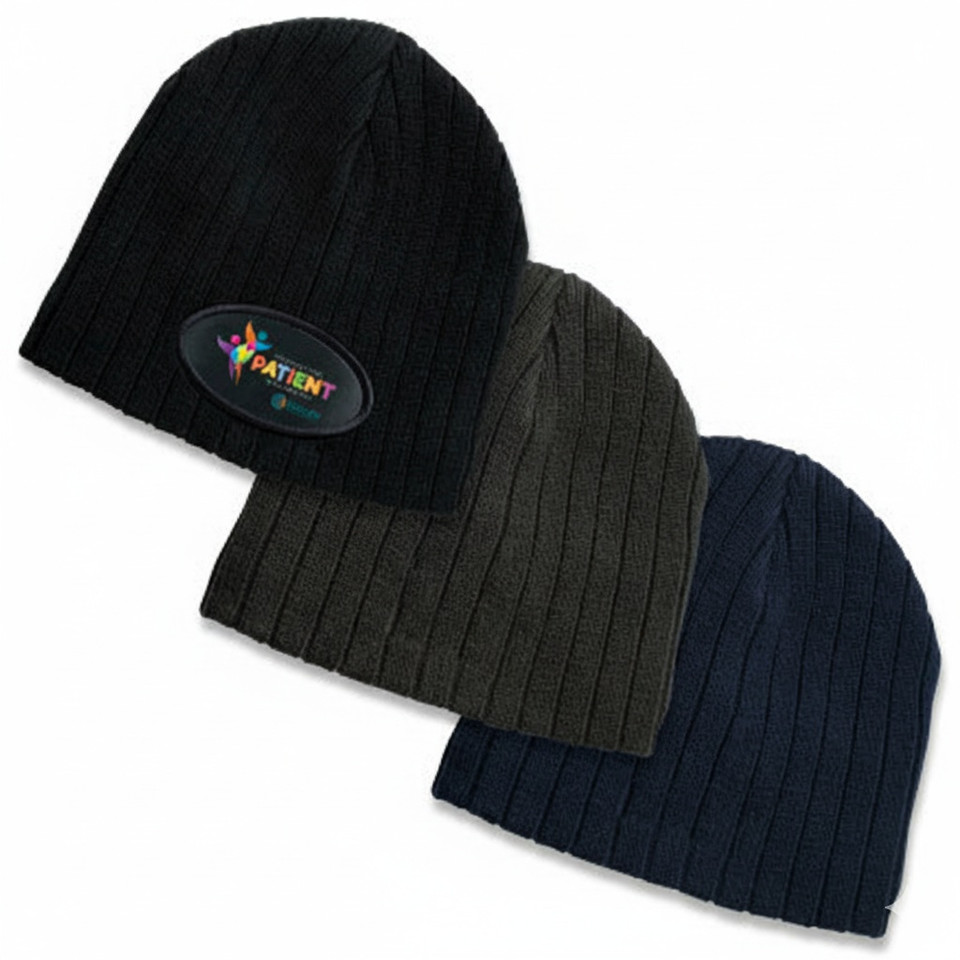 Three cable knit beanies in black, charcoal grey, and navy blue with ribbed texture and turned-up cuffs