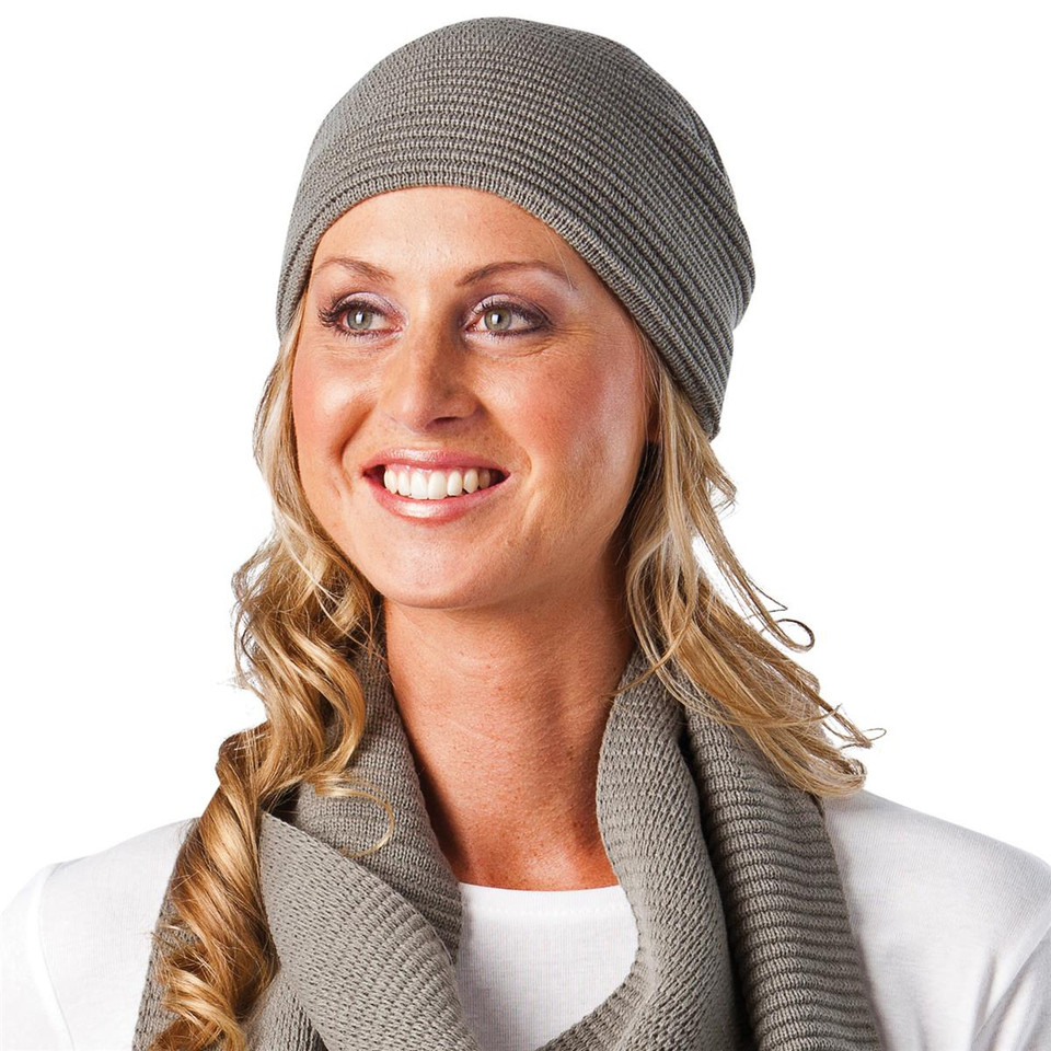 Grey ribbed knit fleece-lined beanie with fold-up cuff worn on model with matching scarf