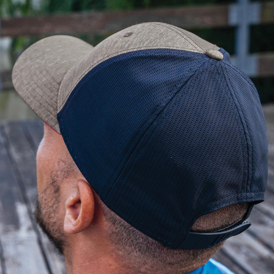 Navy and grey marle trucker caps with structured crown and mesh back panels worn by models outdoors