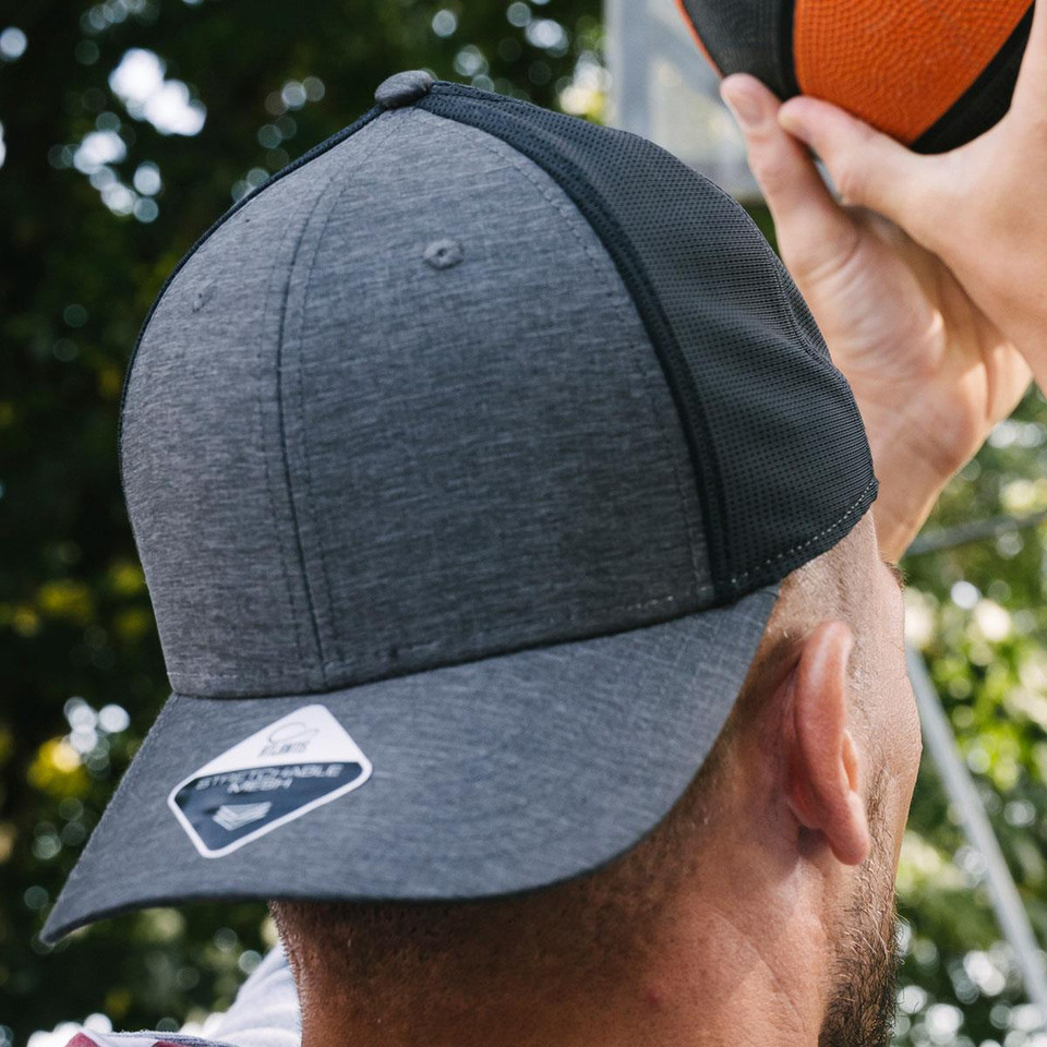 Charcoal grey heather front panel trucker cap with black mesh back and structured six-panel construction