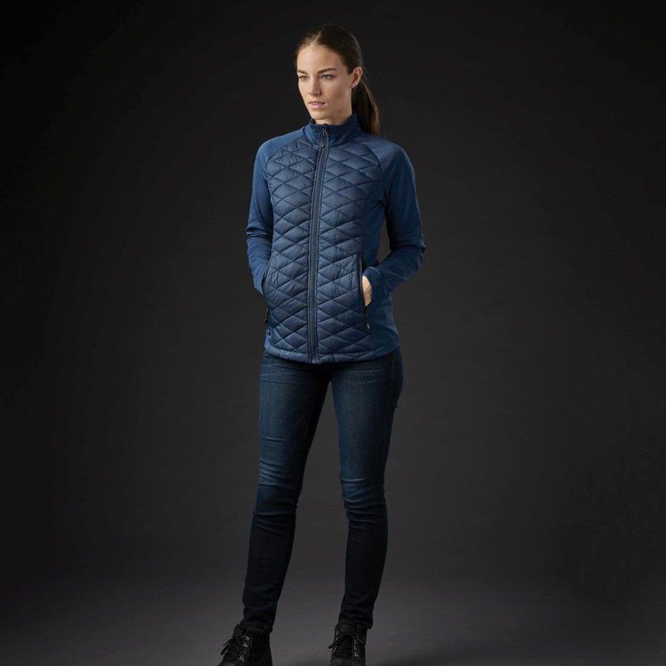 Navy quilted jacket with contrast sleeves and full-length zip worn over dark activewear