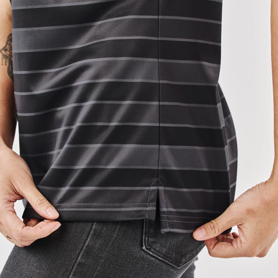 Close-up of charcoal and black horizontal striped women's polo hem with side split detail