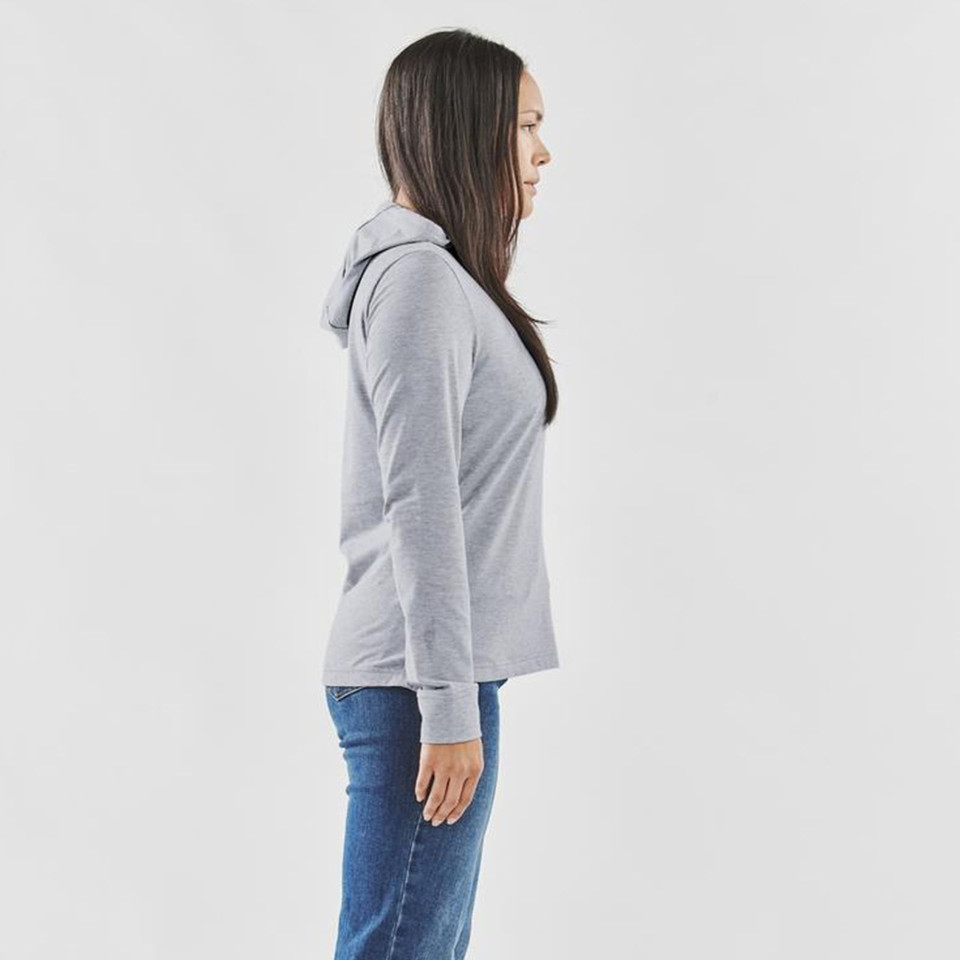 Side profile of woman wearing light grey marl lightweight pullover hoodie with long sleeves and ribbed cuffs